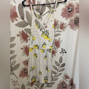 Romper. Cute Lemmon polka crisscross back romper